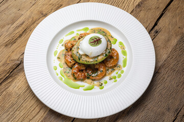 poached egg with avocado, tiger prawns and red caviar