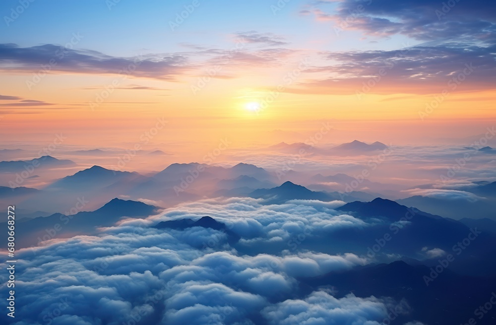 Poster the sun is setting over a mountain range with clouds in the foreground and a bird's eye view of the 