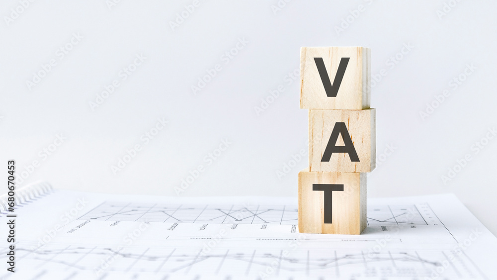 Poster text vat on wooden cube blocks stack on wood table on white background with copy space