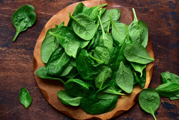 Fresh spinach leaves. Top view with copy space.