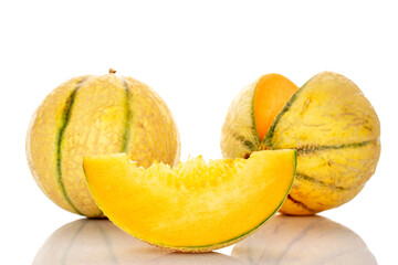 Two melons and one slice in focus, close-up, on a white background.