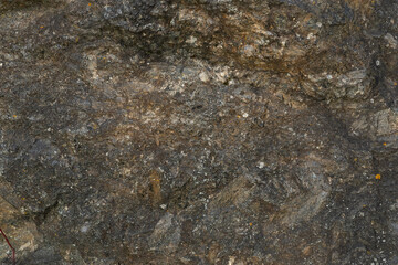 Background of old mountain stone in gray color. Close up of beautiful weathered stone. Beautiful...