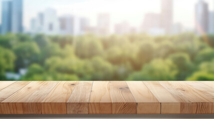 Empty wooden tabletop as a product presentation surface against a cityscape with a park on a summer day.