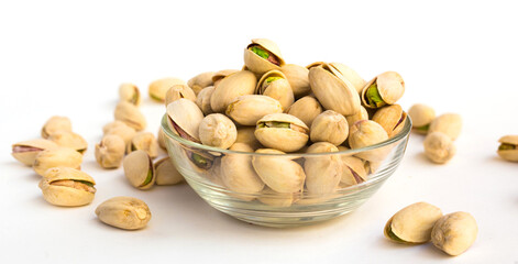 Roasted pistachios on white background