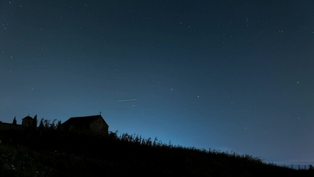 Small church on a hill under the starry sky ,4k, timelapse