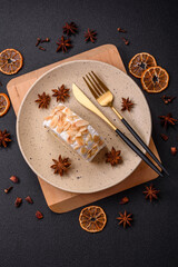 A piece of delicious sweet meringue roll with mascarpone cheese, berries and almonds