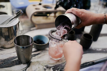 cocktail preparation in the evening bar