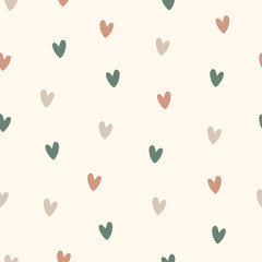Hand drawn seamless vector pattern of small pastel colored hearts in boho style on a milky background.