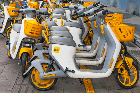 Zhuji, Zhejiang , China - June 21 ,2023: View of electric scooters, popular transport in China,  rental in Zhuji city  street
