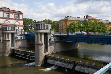 Fototapeta premium Hradec Kralove, Czech Republic - July 22, 2023 - the Moravian weir with hydroelectric power plant in the middle of summer 