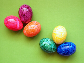Colorful Easter eggs on a green background