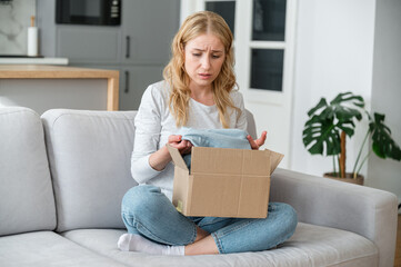 Upset woman client received defective goods in box