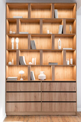 Bookshelf with collections of magazines, books for reading in room