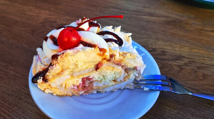 Delicious meringue roll dessert on a plate. Food