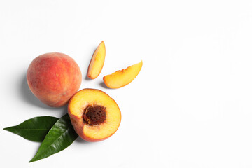 Delicious juicy peaches and leaves on white background, flat lay. Space for text