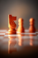 close-up photograph of the horse, a chess piece. Chess is an strategy and intelligence board game. concept of leadership