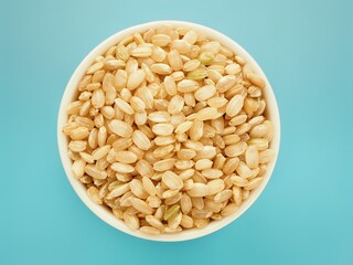 raw integral rice in a bowl top view