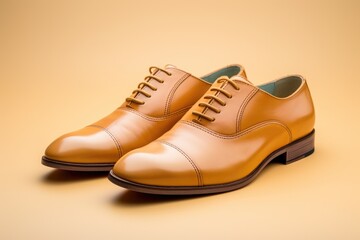Stylish Light Brown Men's Leather Shoes on Solid Colored Background
