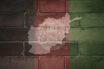 map and flag of afghanistan on a old brick wall