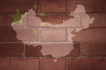 map and flag of china on a old brick wall