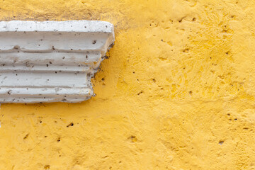 Minimalist yellow and white detail of a stone facade. Simple abstract composition. Makes a nice...
