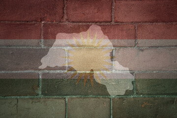 map and flag of kurdistan on a old brick wall