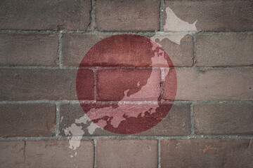 map and flag of japan on a old brick wall