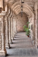 Perspective of carved columns in the Cloister of the La Compania Church, Arequipa, Peru. 17th century. HDR