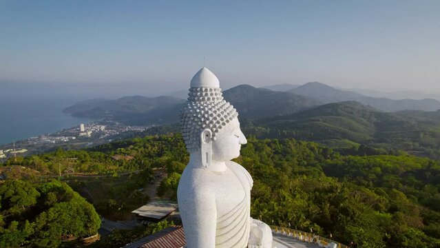 Big Buddha statue at Phuket island, Thailand. Aerial drone footage in sunny weather at morning sunrise