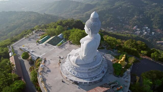 Big Buddha statue at Phuket island, Thailand. Aerial drone footage in sunny weather at morning sunrise