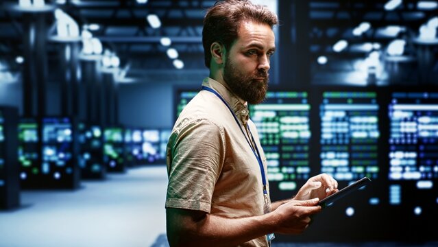 Engineer in data center using renewable solar and wind energy sources to power crypto mining operations. Expert working with eco friendly server clusters preventing significant environmental impact