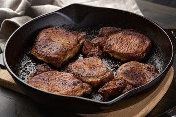 Cast iron skillet with tenderloin steak