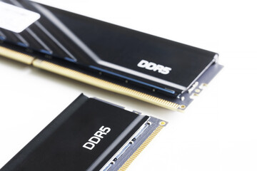 Two modern RAM DDR5 DIMM modules with a black heat sink on a white background. Modern digital...