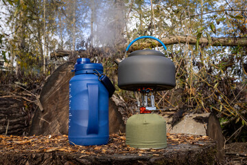 Kettle on stove heating up water outdoors