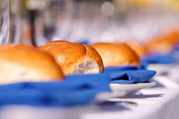 Boston, Massachusetts USA - November 19, 2023: Bread rolls on a Shabbat table installment in the...