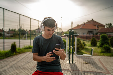 One man caucasian young male stand at outdoor open training park gym