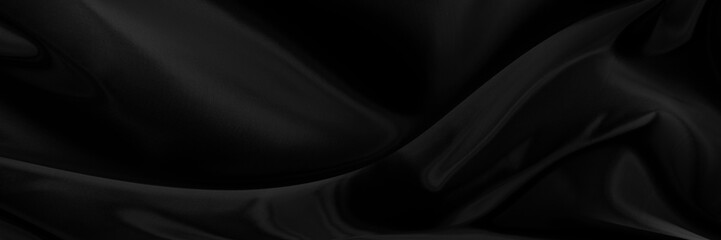 Black gray satin dark fabric texture luxurious shiny that is abstract silk cloth panorama background with patterns soft waves blur beautiful.