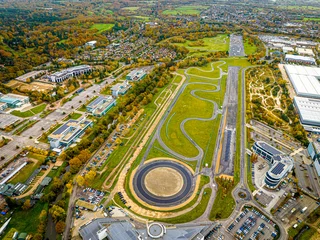 Poster Im Rahmen Aerial view of motor racing circuit and in Brooklands near Weybridge in Surrey, England © Alexey Fedorenko