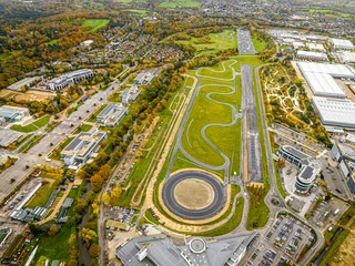 Zelfklevend Fotobehang Aerial view of motor racing circuit and in Brooklands near Weybridge in Surrey, England © Alexey Fedorenko