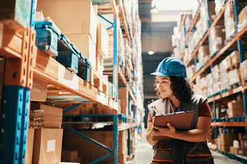Female Inventory Manager with Clipboard in Warehouse Aisle