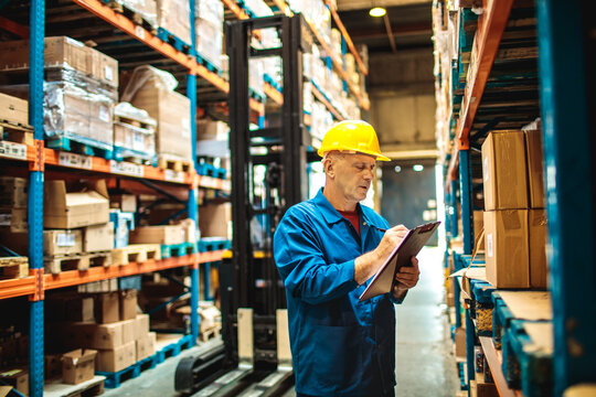 Warehouse Worker Checking Inventory List
