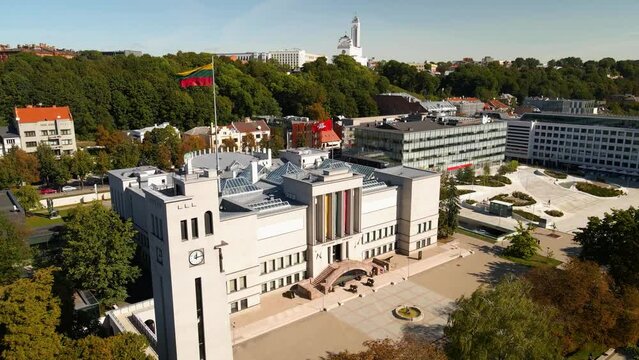 Aerial shot of the Unity Square and war museum with Lithuanian flag in Kaunas, in Lithuania on a sunny summer day	