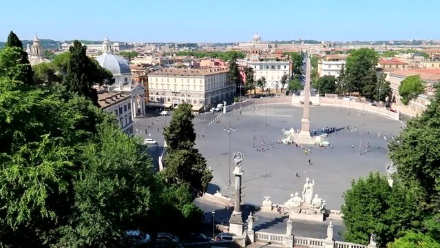 Piazza del Popolo in Rome covered in walking tourists. View from Pincio terrace