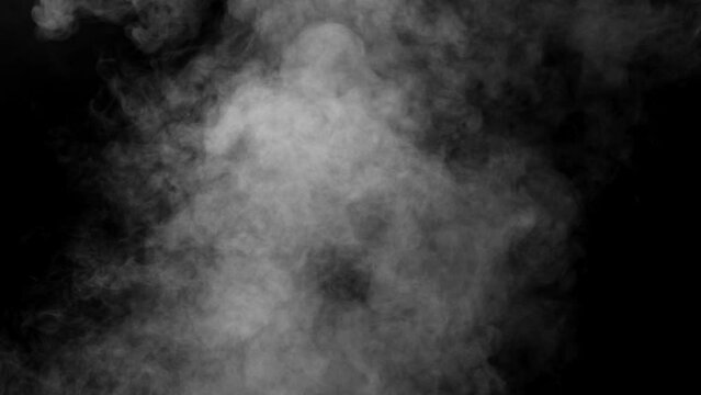 Expansion of Puffs of White Smoke. Puffs of white smoke slowly fill the dark space of the screen