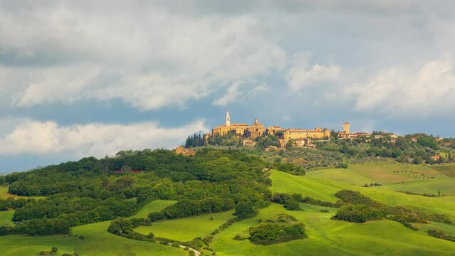 Time lapse of clouds over the hilltop town of Pienza in Tuscany Italy.