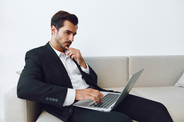 Man sitting job laptop working office businessman sofa