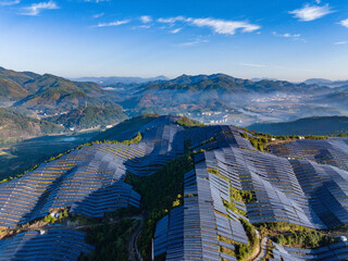 Aerial photography of solar photovoltaic panels on the mountain