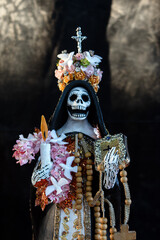 Calavera or catrina dressed as the holy death on day of the dead in mexico