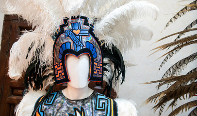 Aztec Mexican dancer headdress with exotic bird feathers and traditional sewing decorations