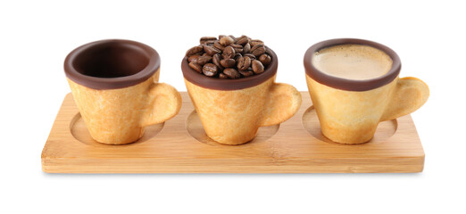 Fototapeta na wymiar Edible biscuit cups with espresso, coffee beans and empty one on white background